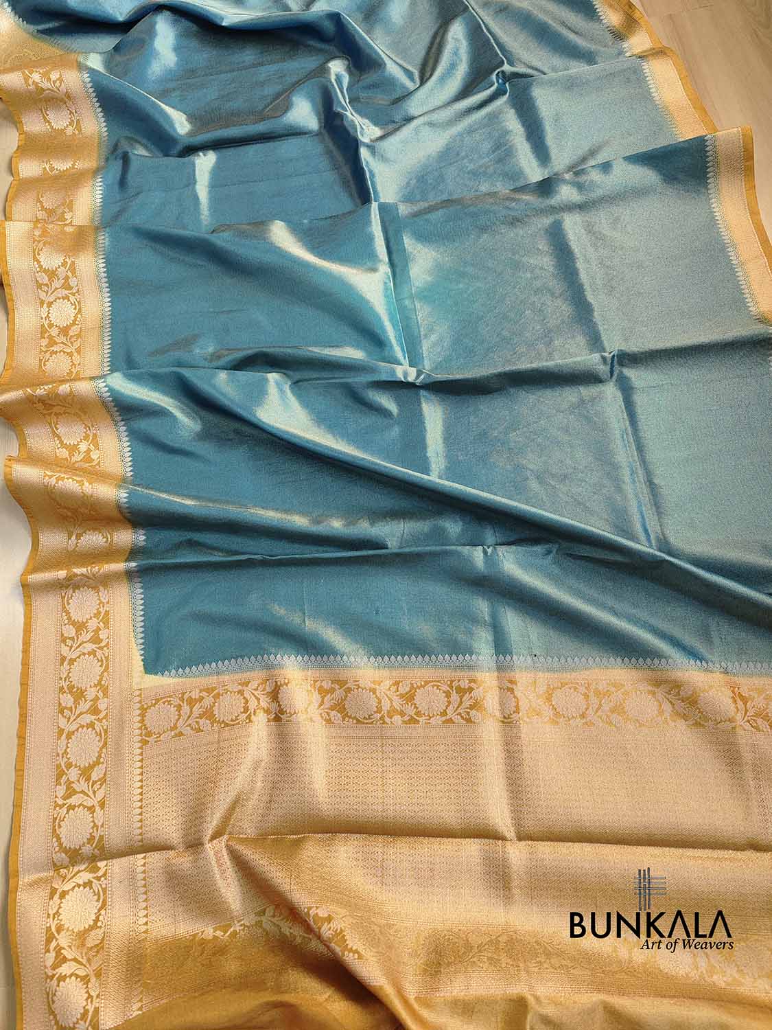 Peacock Blue Plain Soft Tissue Silk Saree with Yellow Floral Design Contrast Border