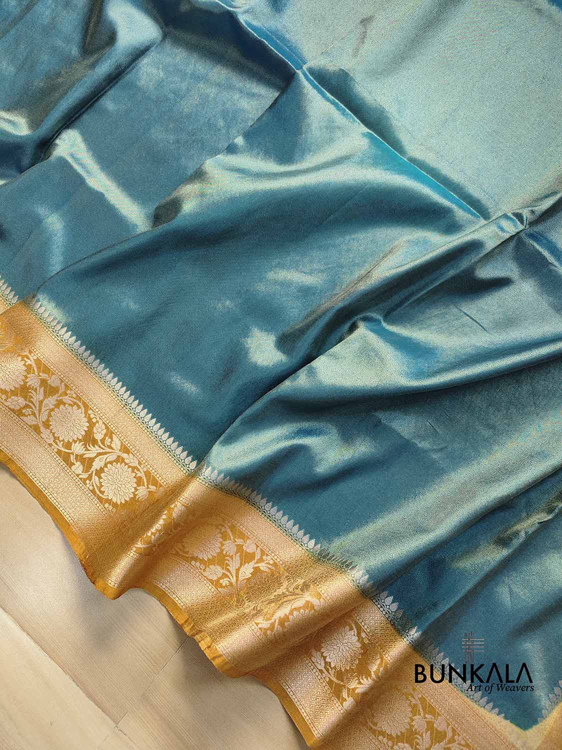 Peacock Blue Plain Soft Tissue Silk Saree with Yellow Floral Design Contrast Border