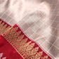 Metallic Grey Pure Katan Silk Checks Design Kadwa Handweaved with Contrast Red Kadiyal Border Banarasi Saree